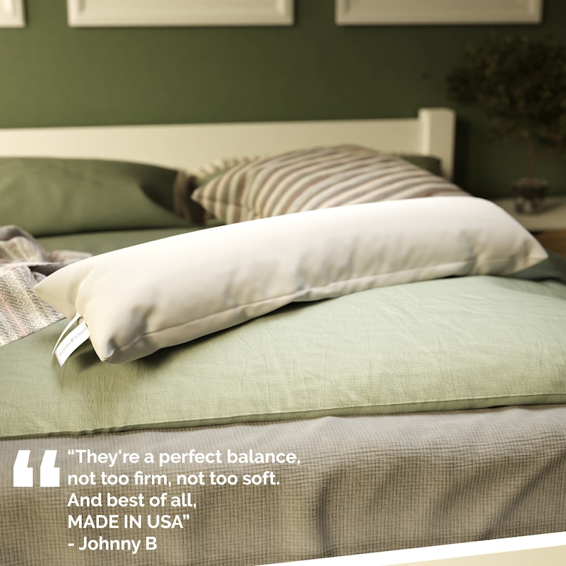 May include: A white body pillow on a green bed with a quote about the pillow: "They're a perfect balance, not too firm, not too soft. And best of all, MADE IN USA" - Johnny B