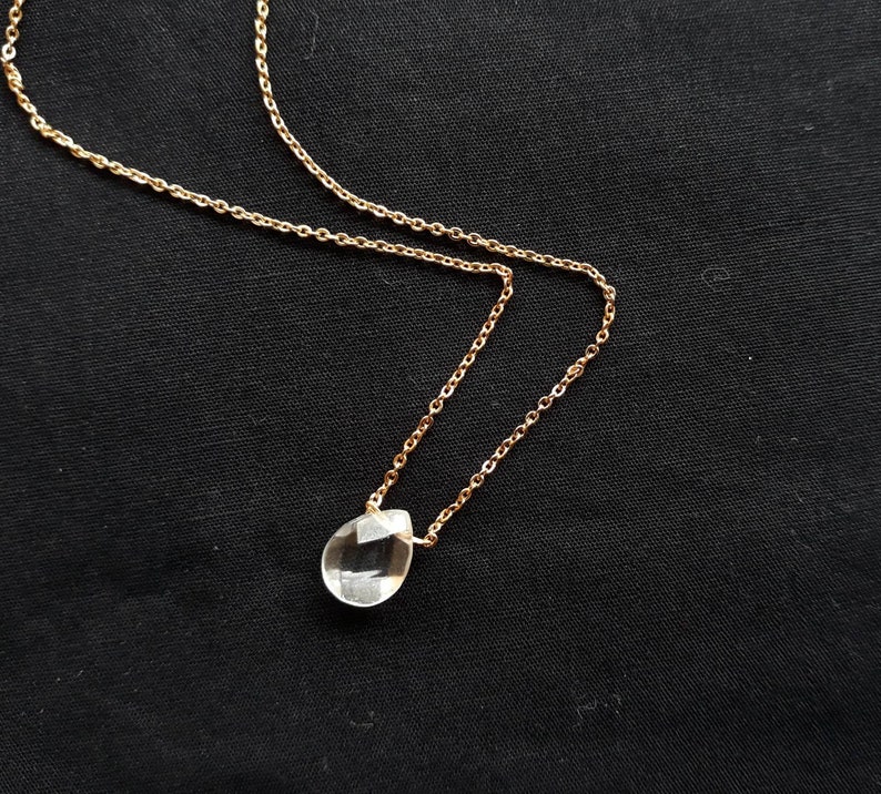 Flat drop rock crystal collar with facets very fine chain.