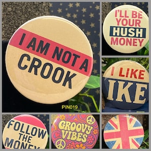 May include: A collection of round pinback buttons with various designs and text. One button reads "I AM NOT A CROOK" in black and red. Other buttons say "I'LL BE YOUR HUSH MONEY", "I LIKE IKE", "FOLLOW THE MONEY", "GROOVY VIBES", and a Union Jack.