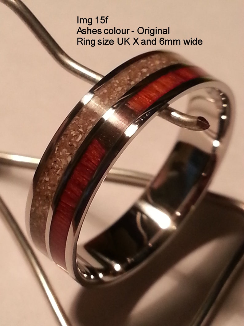 May include: A silver ring with a red and white inlay. The ring is 6mm wide. Img 15f Ashes colour - Original Ring size UK X and 6mm wide