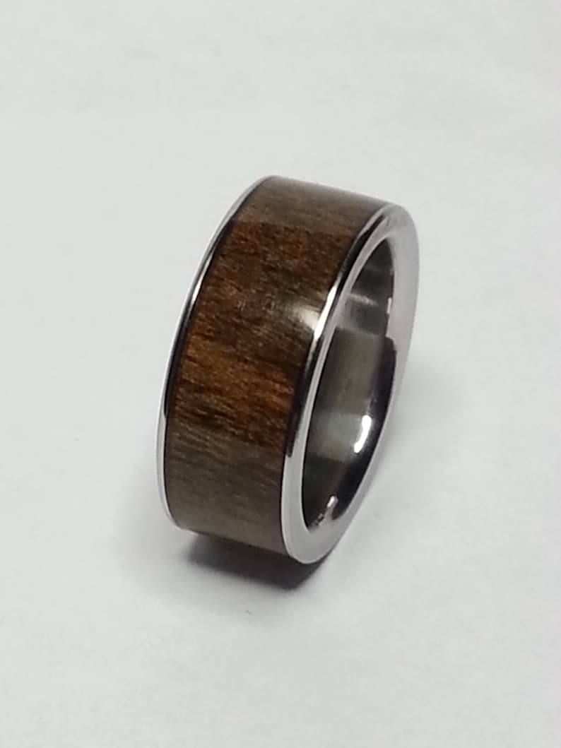 Handmade custom ring made with Stainless Steel and American Wallnut wood