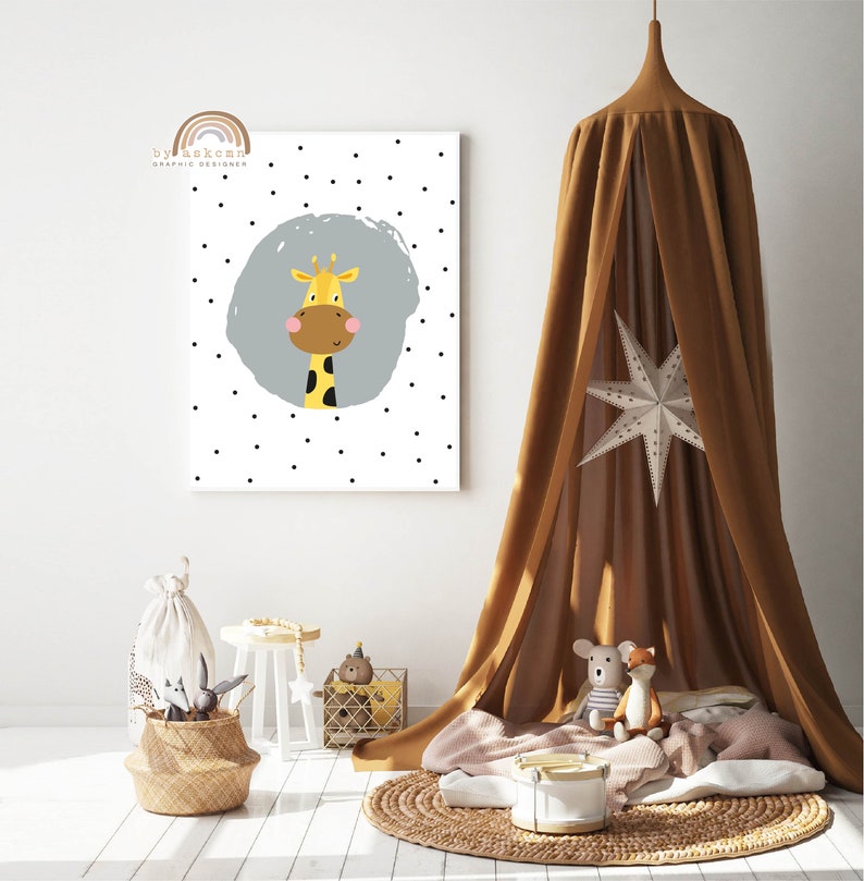 May include: A framed wall art print featuring a cartoon giraffe with a yellow body, brown spots, and a friendly expression. The giraffe is set against a gray circle on a white background with scattered black dots. The room is decorated with a brown canopy, toys, and a woven basket.