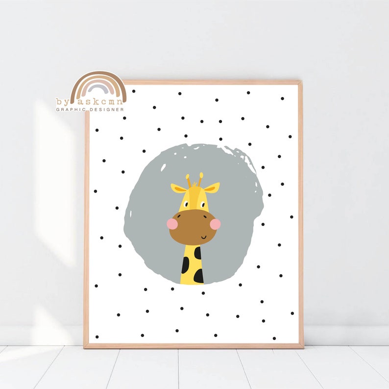 May include: A framed art print featuring a cartoon giraffe with a yellow body, brown snout, and a gray background. The giraffe is centered on a white background with black polka dots. The text "by askcmn graphic designer" is in the upper left corner.