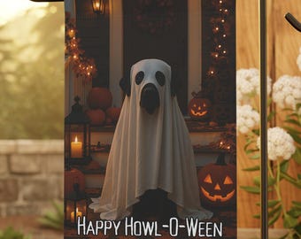 May include: A Halloween garden flag featuring a dog dressed as a ghost, with the text "HAPPY HOWL-O-WEEN". The flag is set in a garden with pumpkins, candles, and a house in the background. The flag is displayed on a black metal stand.
