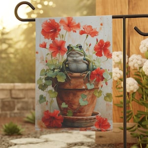 May include: A green frog sits in a terracotta pot with red flowers. The pot is on a small saucer. The frog is surrounded by green leaves and red flowers. The image is a watercolor painting.