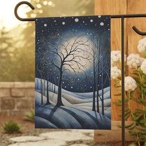 May include: A blue and white garden flag with a whimsical illustration of a moonlit forest scene. The flag features a large, full moon with a tree in the foreground and a snowy landscape in the background.