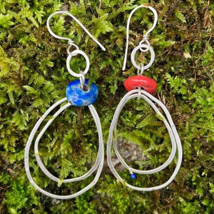 Handmade asymmetrical statement earrings: Blue and red raku beads and abstract silver hoops