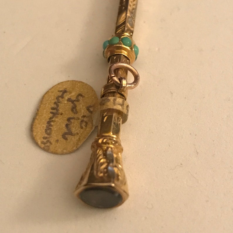 Antique Victorian 9ct Gold Retractable Pencil with seven turquoise stones and smokey quartz end.