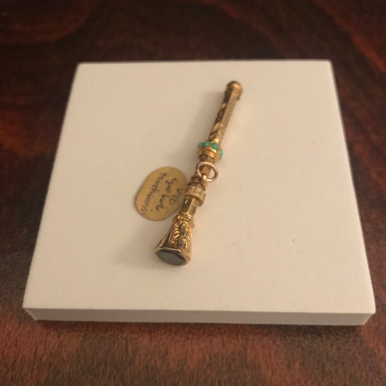 Antique Victorian 9ct Gold Retractable Pencil with seven turquoise stones and smokey quartz end.