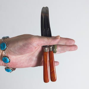 set of 2 german knives with marbled vermilion bakelite handles. rostfrei solingen heritage mid-century. 