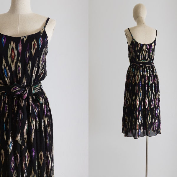 Brilliant ikat dress 1970s Radley England lamé rayon disco dress, gold-tone colored metallic pattern on the sheer black, spaghetti straps