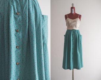 Austrian floral skirt w/big pockets 90s tyrol tirol heart button front loose midi skirt. mauve ditsy-florals on the seafoam green background