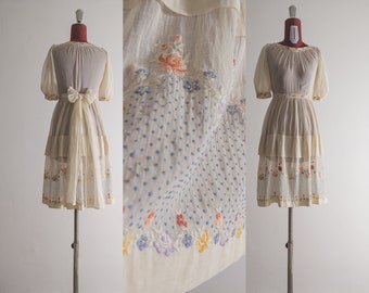 creamy ecru cotton lawn muslin teen dress with floral and swiss dot gorgeous embroidery. snap-attached embroidered sash. vintage find 50s