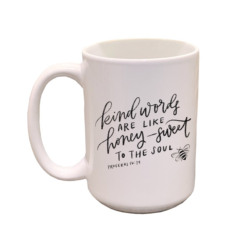 May include: White ceramic mug with a black design that reads "Kind words are like honey-sweet to the soul, Proverbs 16:24". A small bee illustration is to the right of the text.