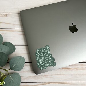 May include: A green sticker with white lettering on a silver laptop. The sticker features a quote from the Bible: "For I know the plans I have for you," declares the Lord, "plans to prosper you and not to harm you, plans to give you hope and a future." - Jeremiah 29:11