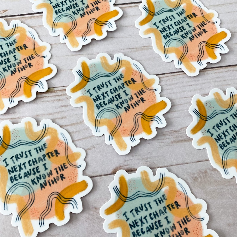 May include: Six colorful stickers with abstract designs and the text "I trust the next chapter because I know the author" repeated on each sticker.