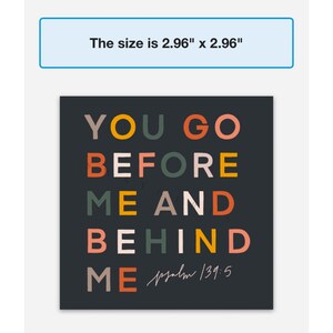 May include: A black square print with colourful text that reads "YOU GO BEFORE ME AND BEHIND ME Psalm 139:5".