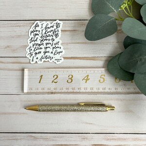 May include: A white sticker with black calligraphy text that reads "for I know the plans I have for you, declares the Lord, "plans to prosper you and not to harm you, plans to give you a hope and a future." Jeremiah 29:11