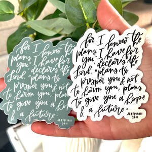 May include: Two stickers with a white background and black lettering. The stickers feature the Bible verse Jeremiah 29:11, which reads "For I know the plans I have for you" declares the Lord. "Plans to prosper you and not to harm you, plans to give you hope and a future."
