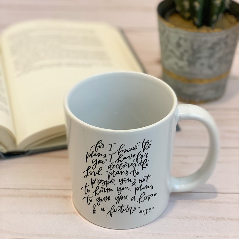 May include: White ceramic mug with a black inspirational quote from Jeremiah 29:11. The quote reads "for I know the plans I have for you, declares the Lord, "plans to prosper you and not to harm you, plans to give you hope and a future."