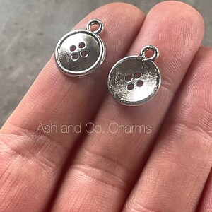 Silver button charms, made from silver alloy. Perfect for earrings, pendant or all your jewellery making needs. x 6