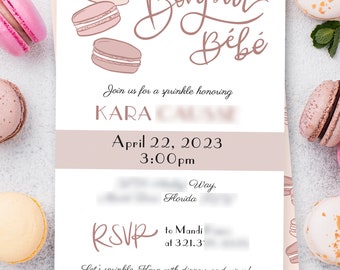 May include: A pink and white baby shower invitation with the text "Bonjour Bébé" and a drawing of macarons. The invitation is for Kara and is scheduled for April 22, 2023 at 3:00pm. The RSVP information is to Mandi at 321.31. The text "Let's sprinkle Kara with diapers and wipes!" is at the bottom of the invitation.