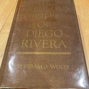 May include: The Fabulous Life of Diego Rivera by Bertram D. Wolfe, a brown hardback book with gold lettering.