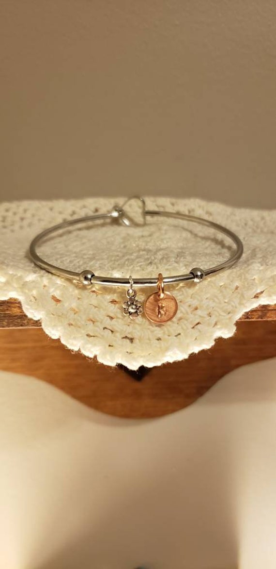 DiamondJewelryNY Eye Hook Bangle Bracelet with a Holy Communion Charm.