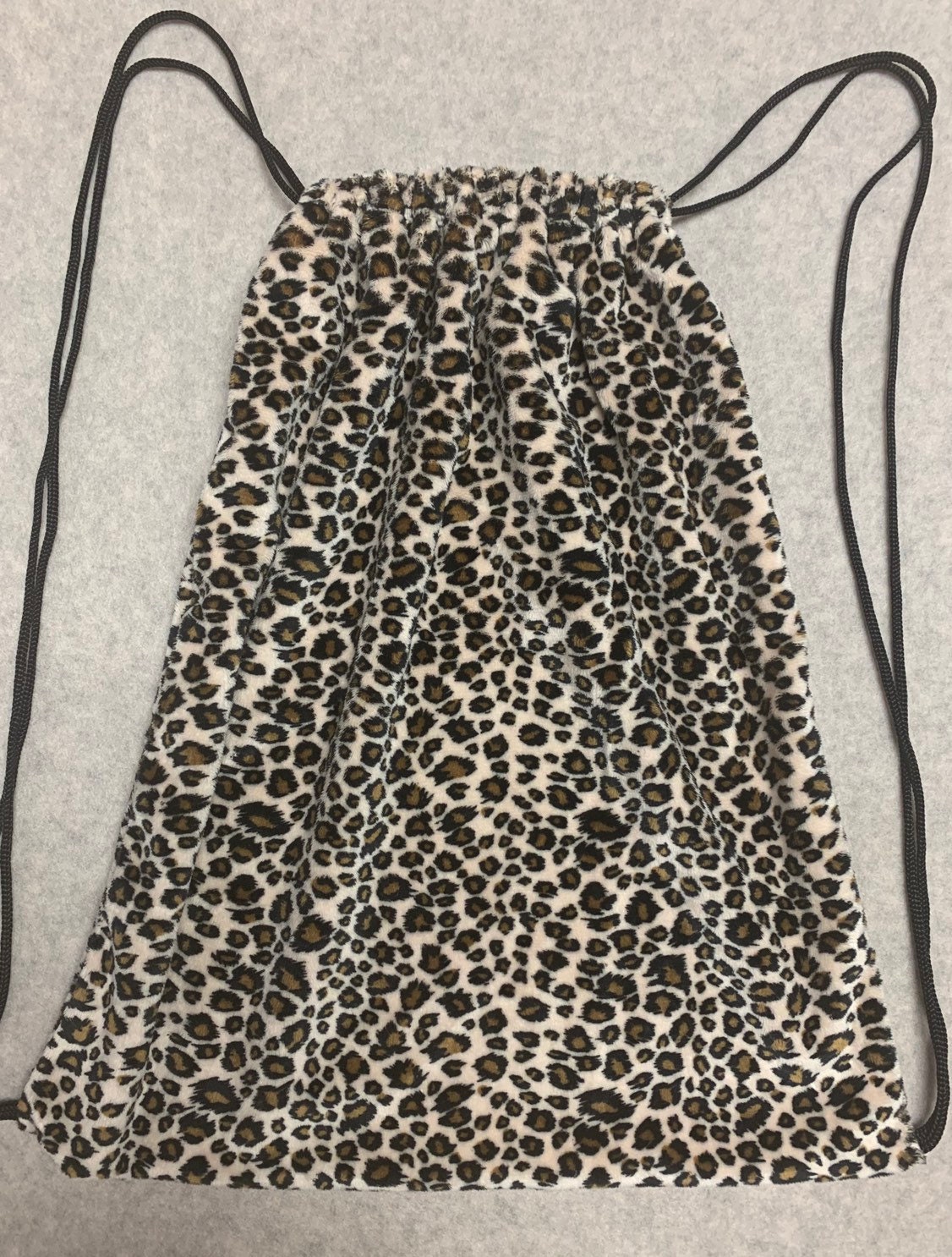Animal print drawstring bags top