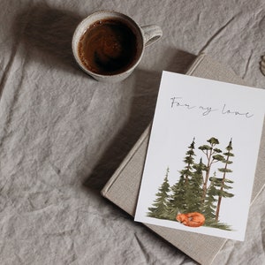 May include: A white card with the text "For my love" written in black ink. The card features a watercolor illustration of a sleeping fox in a forest setting with green trees.