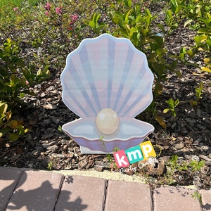 Ideas de decoración para fiestas infantiles con recortes de personajes de almejas y perlas