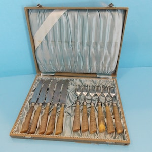 Antique Climax Sthal fork, and knife set J. Seybold