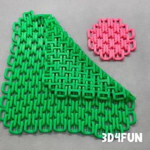 May include: Two green and one pink 3D printed chainmail coasters. The coasters are made of interlocking plastic rings. The text "3D4FUN" is printed on the bottom right corner of the image.