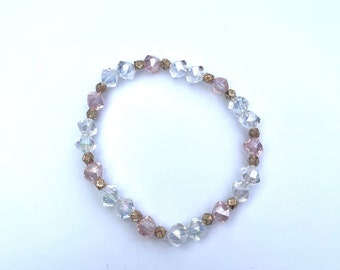 Pink and clear beaded stretch bracelet with gold spacers