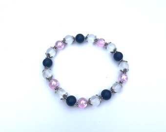 Pink, clear, and black glass beaded stretch bracelet with silver accents