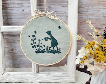 Embroidery frame picture garden girl