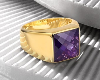 May include: A gold ring with a square-shaped amethyst gemstone. The ring has a textured band.