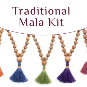 May include: A collection of wooden mala beads with colorful tassels. The beads are strung together, and the tassels are in shades of orange, blue, green, purple, and pink. The text "Traditional Mala Kit" is displayed at the top.