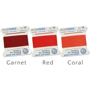 May include: Three spools of nylon thread in garnet, red, and coral. Each spool is labelled "NYLON POWER" and "No. 10" with a diameter of 0.90 mm. The text "For stringing pearls and beads" is also visible.