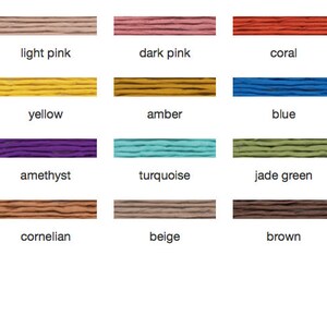 May include: A color chart featuring swatches of various colors, including white, pink, red, yellow, blue, green, and black. Each color is labeled with its name, such as "white," "red," and "blue."