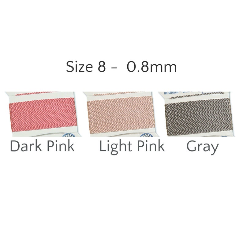 May include: Three spools of Size 8 - 0.8mm thread in dark pink, light pink, and gray. The spools are labeled with their respective colors. The thread is tightly wound on white spools.