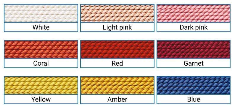 May include: A colour chart displaying nine different shades of yarn. The colours include white, light pink, dark pink, coral, red, garnet, yellow, amber, and blue. Each colour is shown in a rectangular box with the colour name below.