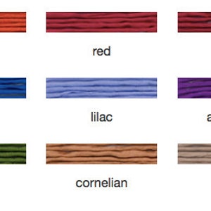 May include: Nine color swatches of thread in coral, red, garnet, dark blue, lilac, amethyst, olive, cornelian, and beige. Each swatch is labeled with its corresponding color name in a sans-serif font.