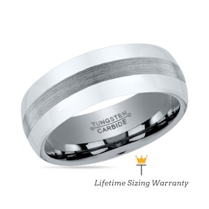May include: A silver tungsten carbide ring with a brushed finish and a beveled edge. The ring has a lifetime sizing warranty.