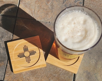 New Mexico flag coasters with the Zia sun symbol, laser engraved on bamboo coasters. Albuquerque, Santa Fe, Las Cruces, Rio Rancho, Roswell