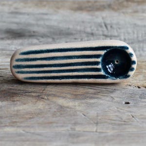 White ceramic pipe with blue stripes and bowl