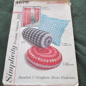 May include: Vintage Simplicity pattern 4679 for smocked home fashions. The pattern includes instructions for a bolster (14" x 7"), a 14" square pillow, and a 14" round pillow. The pattern features gingham designs.
