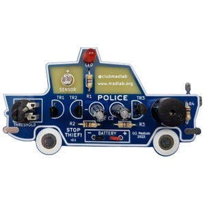 May include: A blue circuit board in the shape of a police car with the word "POLICE" printed on it. The board includes components like an LED, sensor, and a buzzer. Text on the board reads "STOP THIEF!" and "BATTERY".