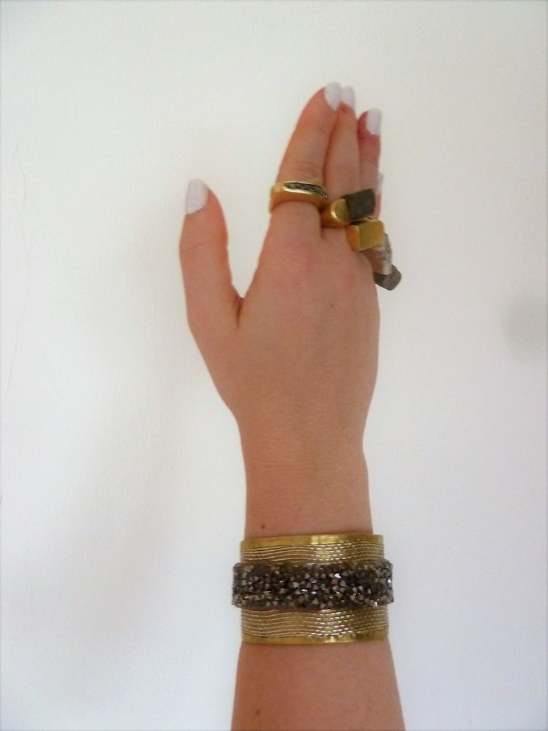 Wide unusual cuff bracelet with crystals