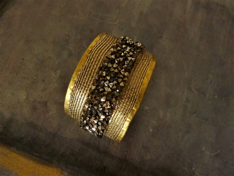 Wide unusual cuff bracelet with crystals